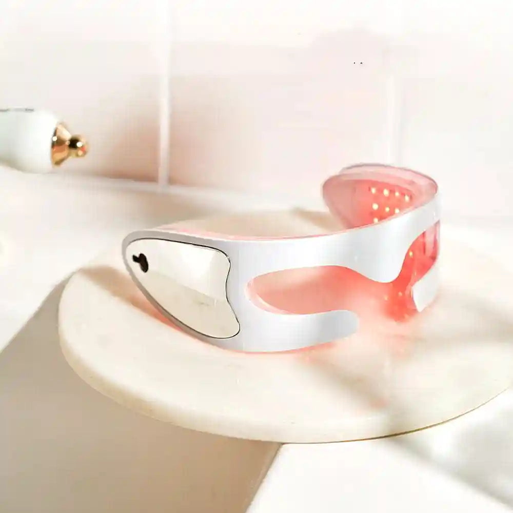Le design épuré du masseur oculaire AuraMask Air™ posé sur un support, mettant en avant sa qualité premium.